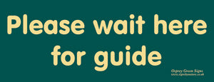 'Please wait here for guide' sign