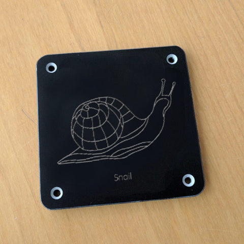 'Snail' rubbing plaque